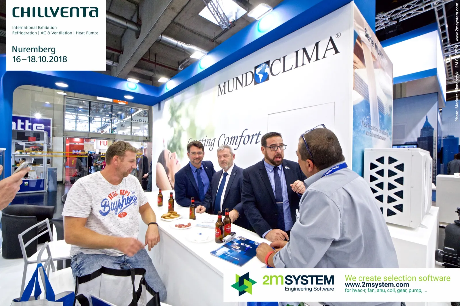 Visitors and staff talk at the Mundoclima bar counter at Chillventa 2018