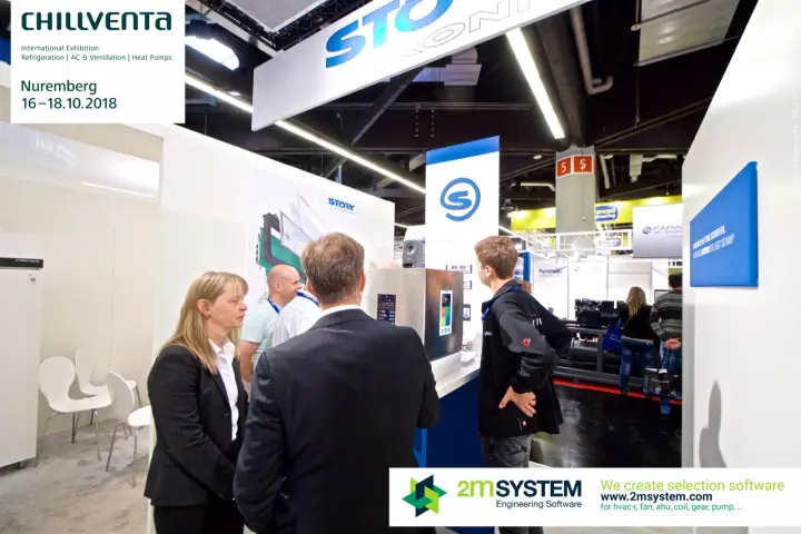 Visitors studying controller touch displays at Störk-Tronic