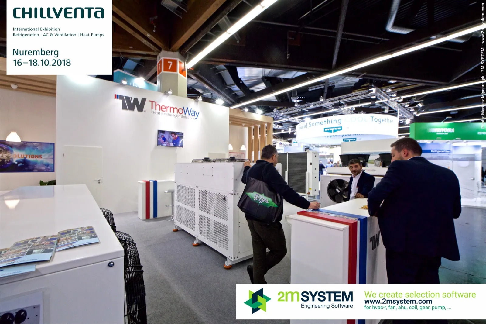 Visitors talking at the ThermoWay counter beside white heat exchanger units at Chillventa 2018