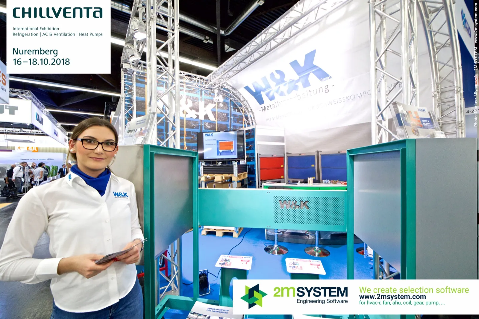 W&K staff member beside the perforated turquoise display frame at Chillventa 2018