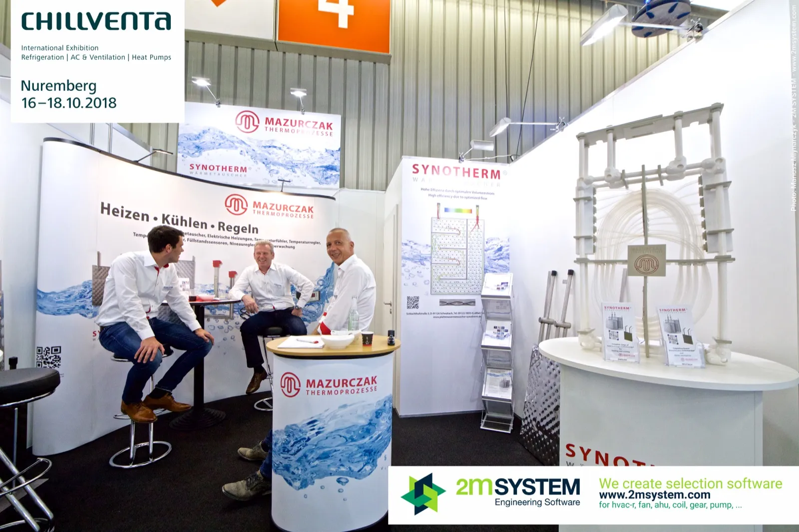 Wide view of the Mazurczak stand with water-themed graphics and staff at Chillventa 2018