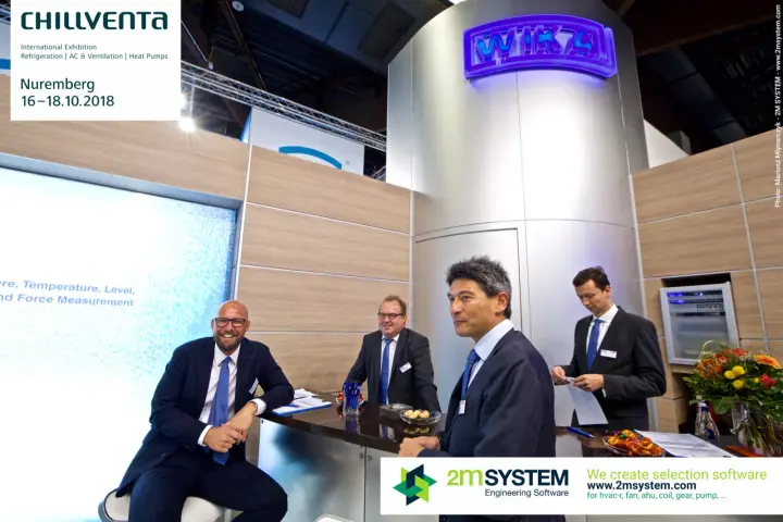 WIKA team at the bar counter below the illuminated logo tower at Chillventa 2018