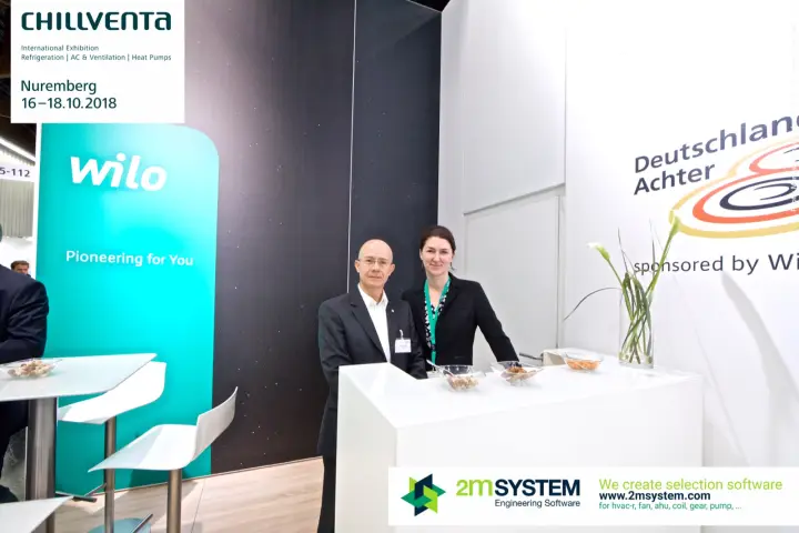 Wilo staff at the counter next to the Pioneering for You panel at Chillventa 2018
