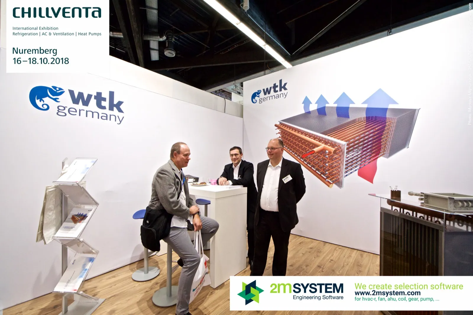 WTK Germany stand with a large finned coil graphic and meeting table at Chillventa 2018