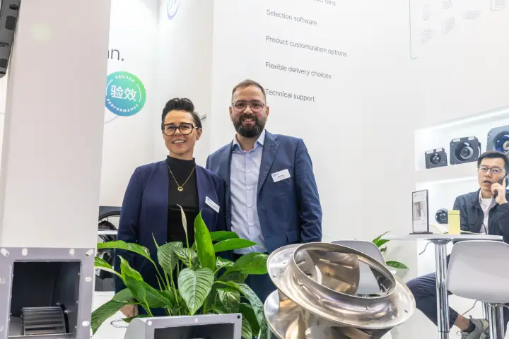 AFL Motors Europe staff behind a stainless steel fan impeller