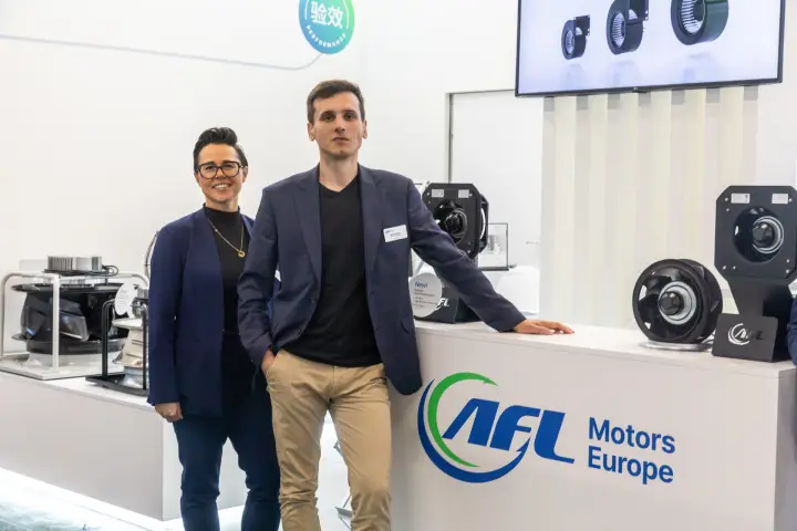 AFL Motors Europe staff beside compact centrifugal fans