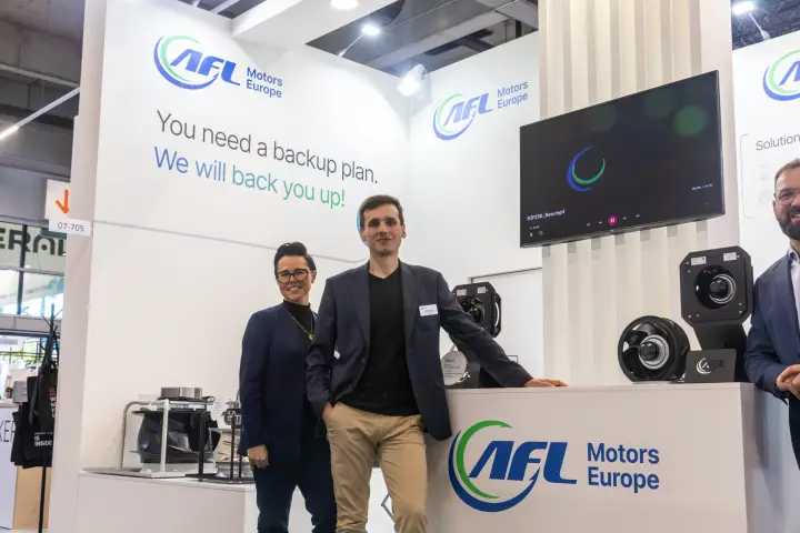 AFL Motors Europe team with a B3P190 video playing on screen