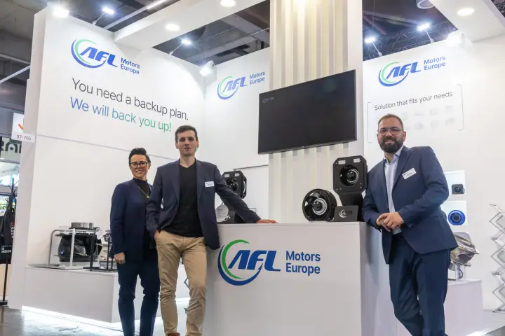 AFL Motors Europe team portrait with EC fans on the counter