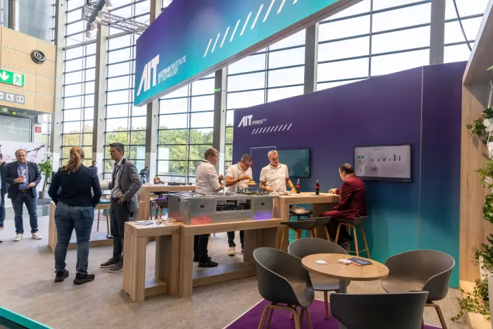 AIT Austrian Institute of Technology stand with demonstration unit counter