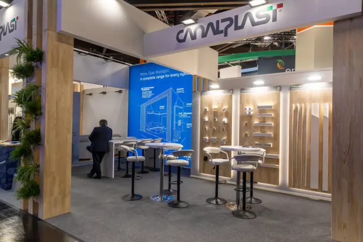 Canalplast stand with AC trunking displays on wooden walls