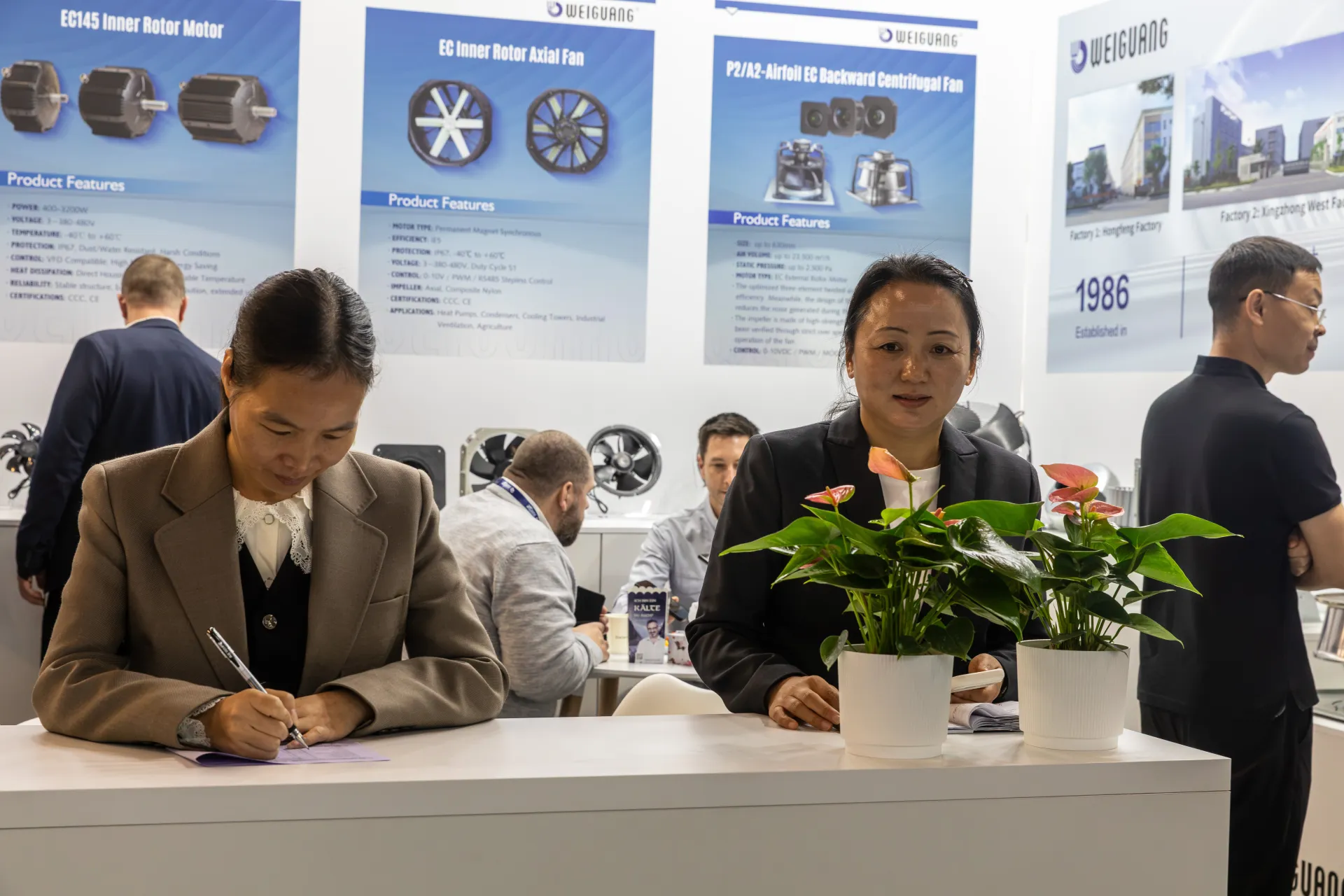 Close view of Weiguang staff at work at the booth counter at Chillventa 2026