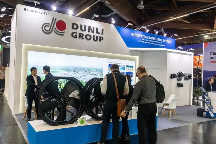 Dunli Group large axial fans with ErP label in front of a factory video wall