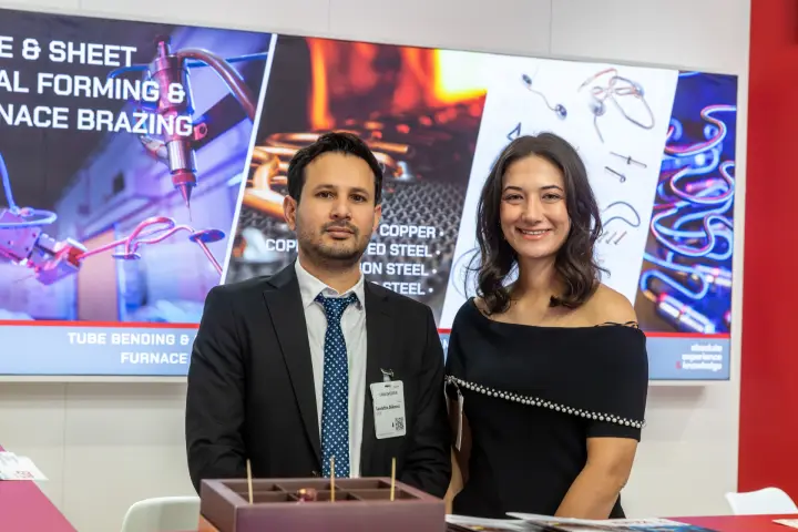EPTA staff at the counter in front of a tube forming and furnace brazing display at Chillventa 2026