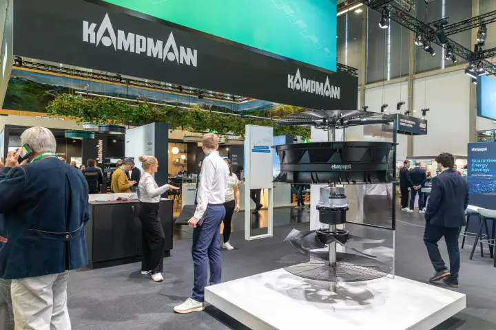 Exploded ebm-papst axial fan model in front of the Kampmann stand at Chillventa 2026