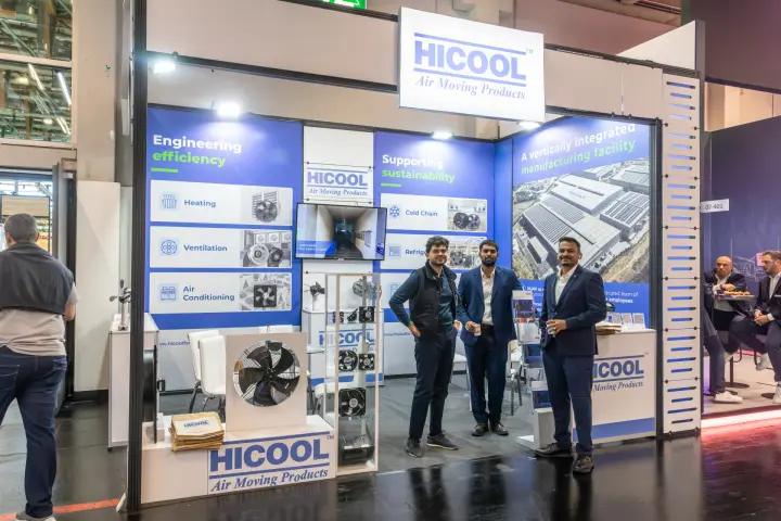 Hicool "Air Moving Products" stand with axial fans and team members