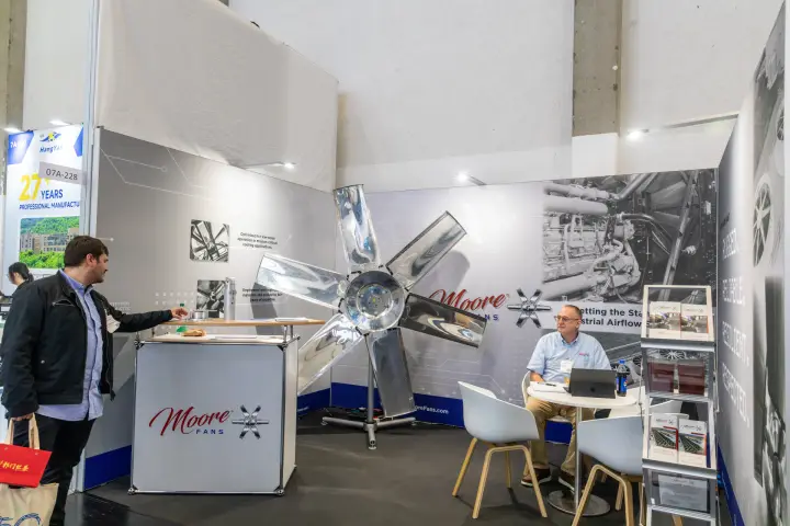 Moore Fans stand with a large polished aluminium axial fan impeller at Chillventa 2026