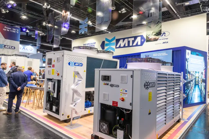MTA air-cooled chillers with open service panels and ICS Cool Energy rental wall at Chillventa 2026