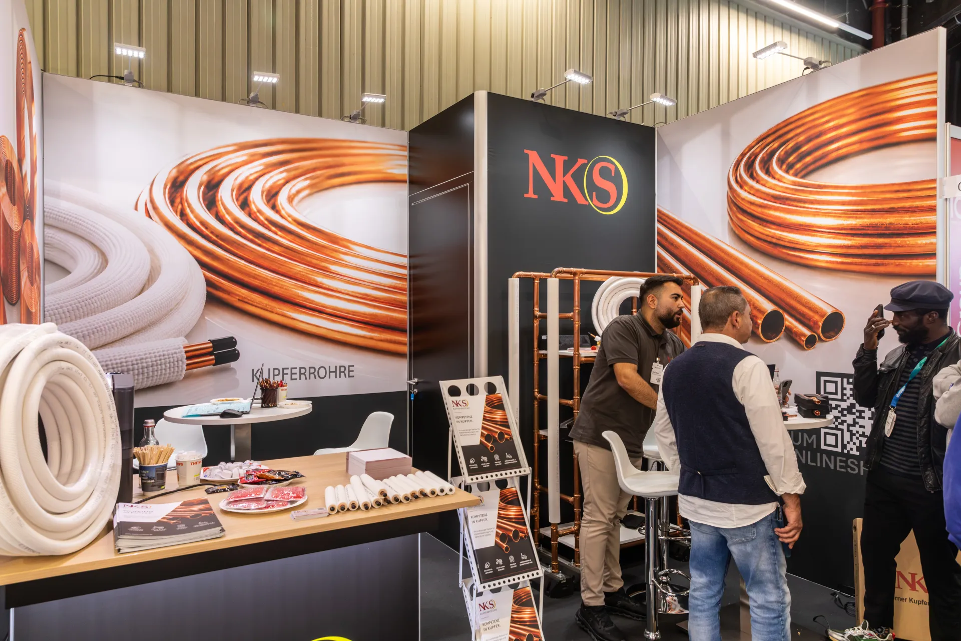 NKS stand with copper tube graphics and insulated pipe coils at Chillventa 2026