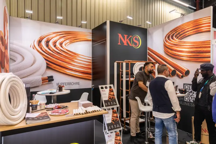 NKS stand with copper tube graphics and insulated pipe coils at Chillventa 2026