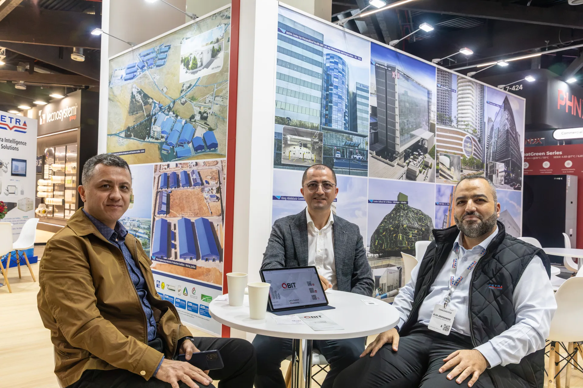 Petra stand visitors in front of reference project and factory photo walls at Chillventa 2026