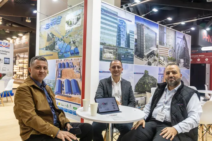 Petra stand visitors in front of reference project and factory photo walls at Chillventa 2026
