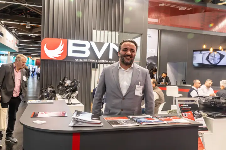Portrait at the BVN counter with axial fans and the meeting area behind at Chillventa 2026