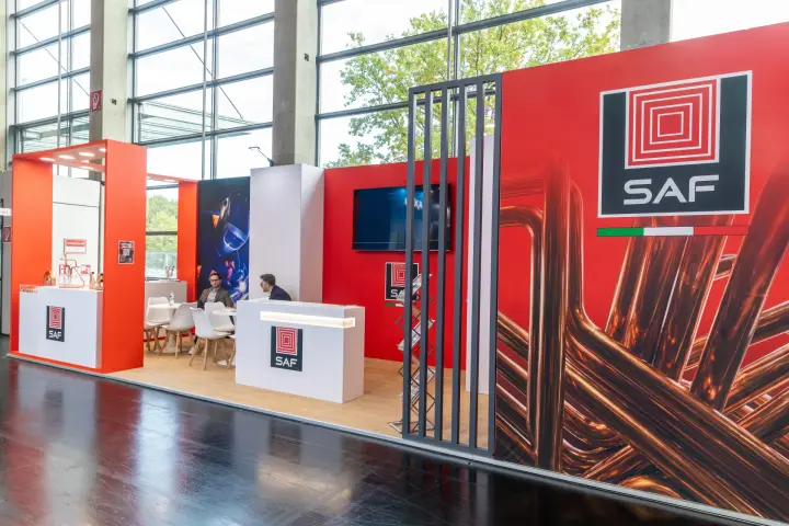 SAF stand with red walls and a large copper tubing graphic at Chillventa 2026