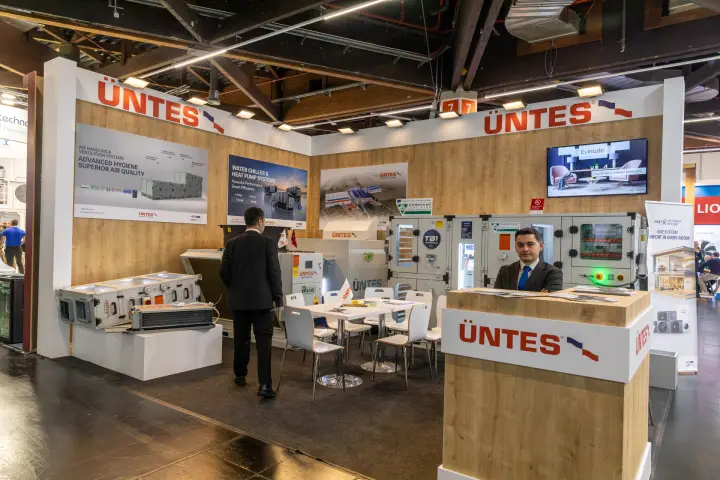 Üntes stand with air handling units, a chiller and wood-panelled walls at Chillventa 2026