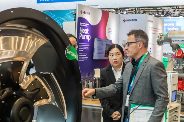 Visitor discussing a large Sanmu axial fan with an ErP2026 label at Chillventa 2026