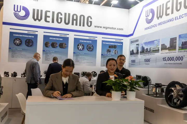 Weiguang staff at the desk with factory facts on the wall behind at Chillventa 2026