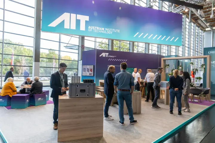 Wide view of the AIT stand with suspended gradient banner