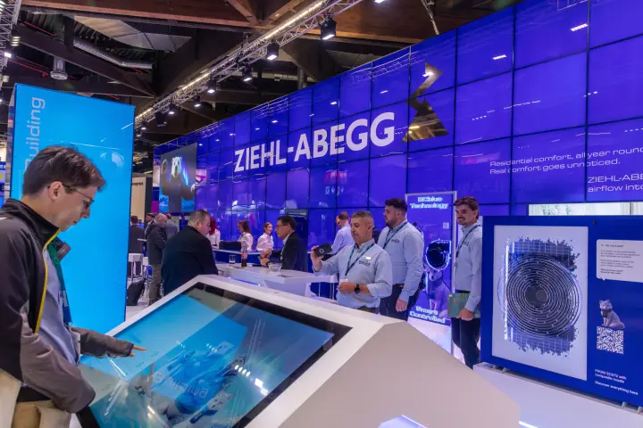 Ziehl-Abegg FP050 fan exhibit and touchscreen kiosk with visitors at Chillventa 2026