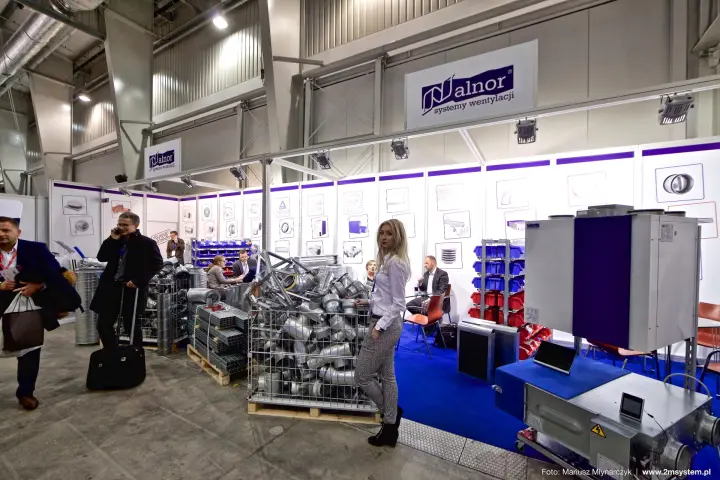Alnor stand with wire baskets of galvanised duct fittings and a heat recovery unit