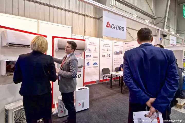 Chigo wall-mounted split units and dehumidifiers on a red-framed display