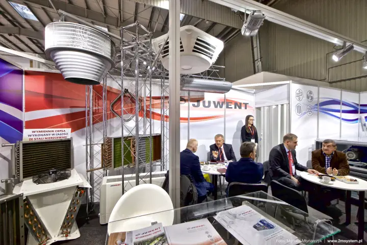 Juwent heat exchangers and meeting tables on a red and white stand