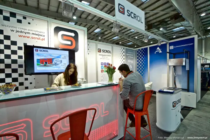 Scrol reception counter with neon logo and Atisa fan coil display at Forum Wentylacja 2016