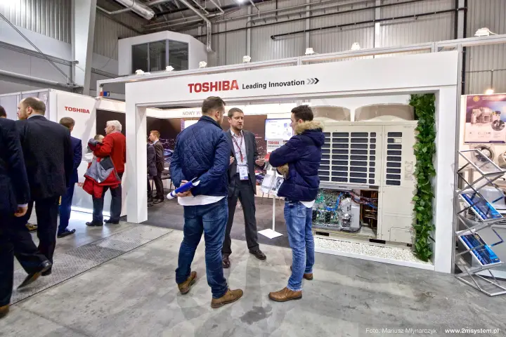 Toshiba VRF outdoor unit with open service panel under "Leading Innovation"