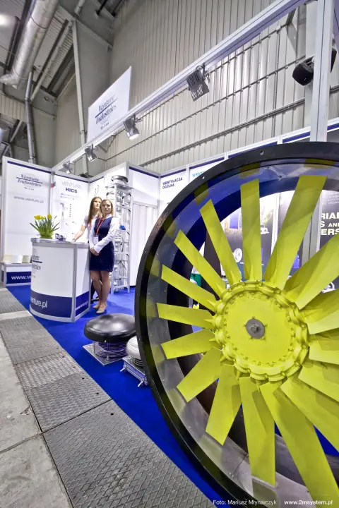 Yellow axial fan impeller in front of the Venture Industries counter at Forum Wentylacja 2016