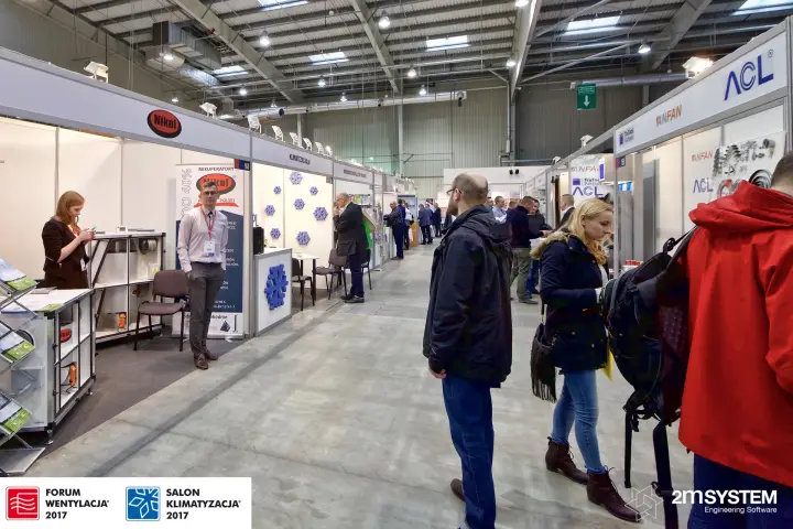Aisle of shell-scheme stands with Nikol heat recovery units in front