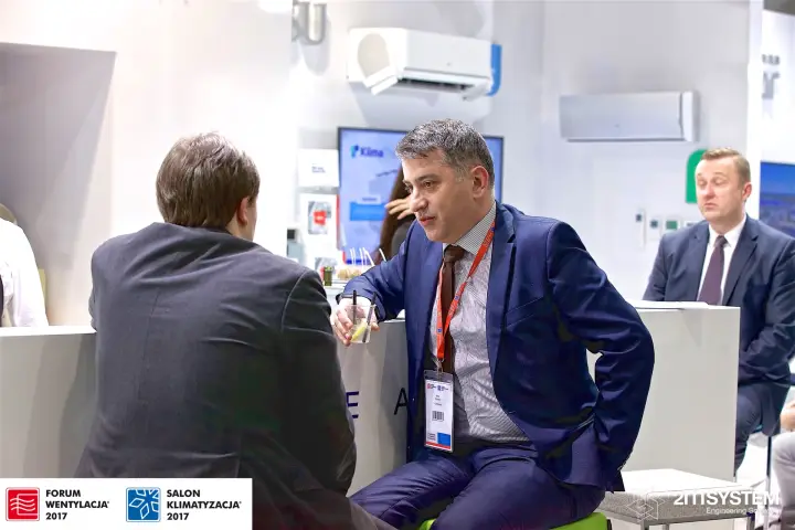 Conversation at the Klima-Therm bar below wall-mounted split units