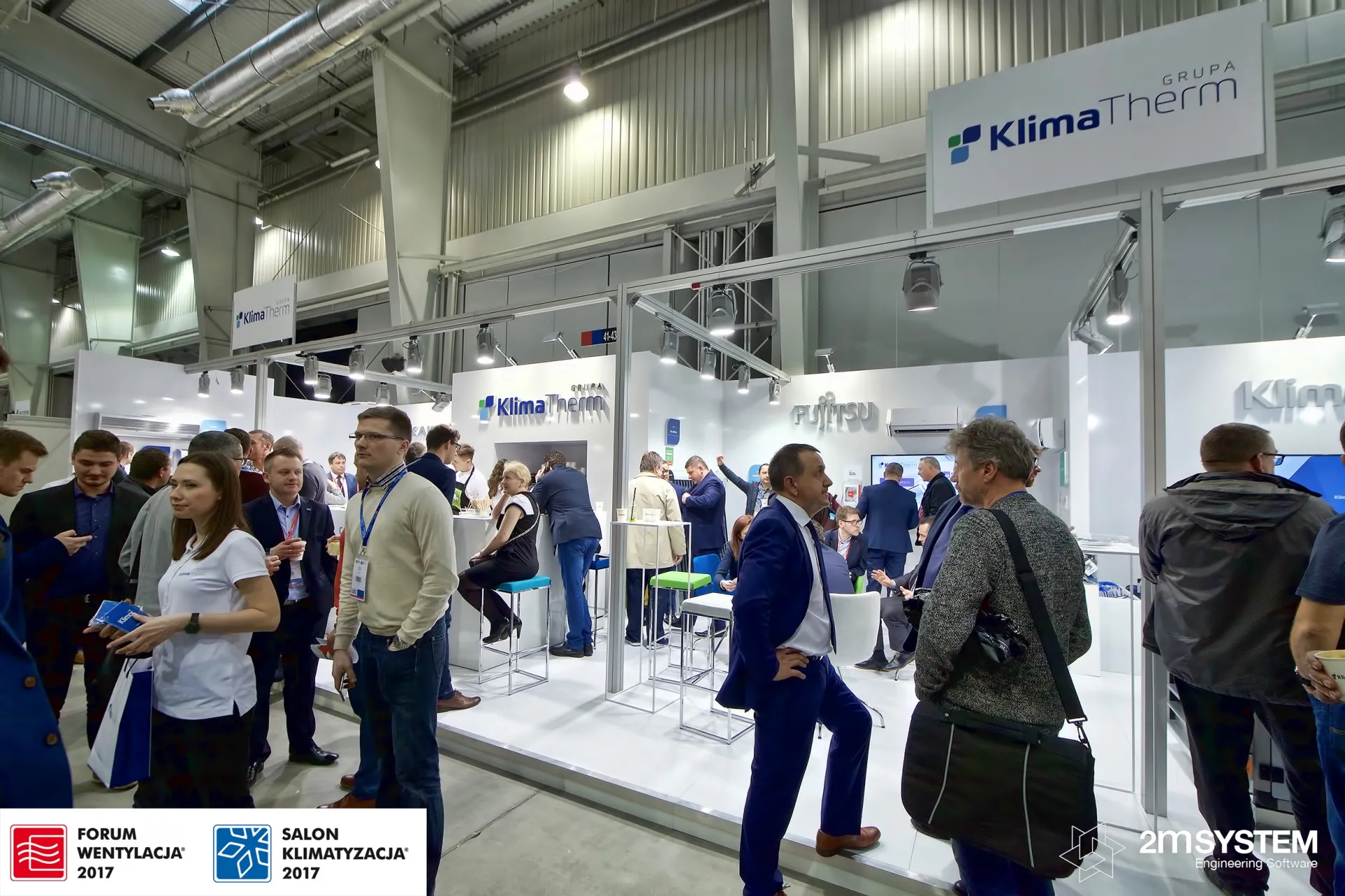 Crowded aisle in front of the large white Klima-Therm stand at Forum Wentylacja 2017
