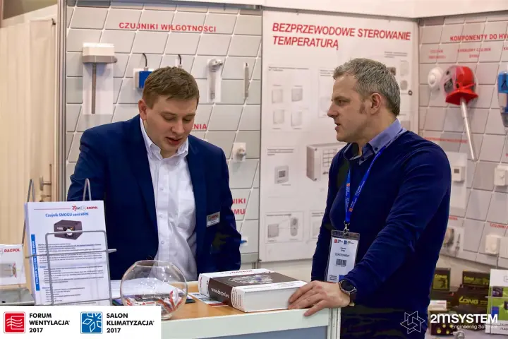 Dacpol staff present the HPM smog sensor and wireless temperature control