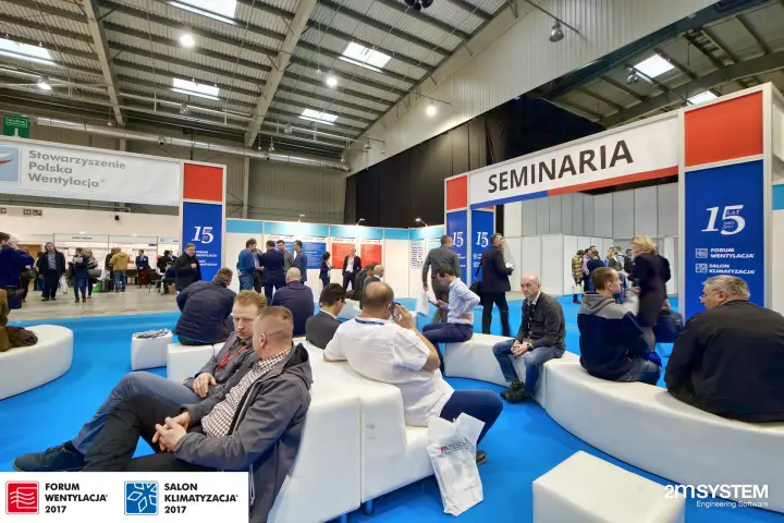 Full seating lounge by the seminar zone, programme boards behind