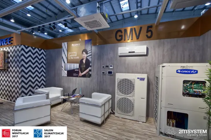 Gree GMV 5 outdoor unit with open panels beside a lounge corner