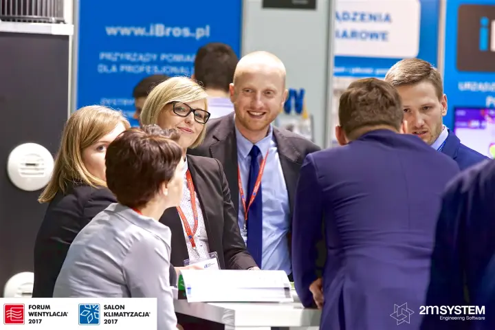 Harmann staff meeting visitors at a stand table at Forum Wentylacja 2017