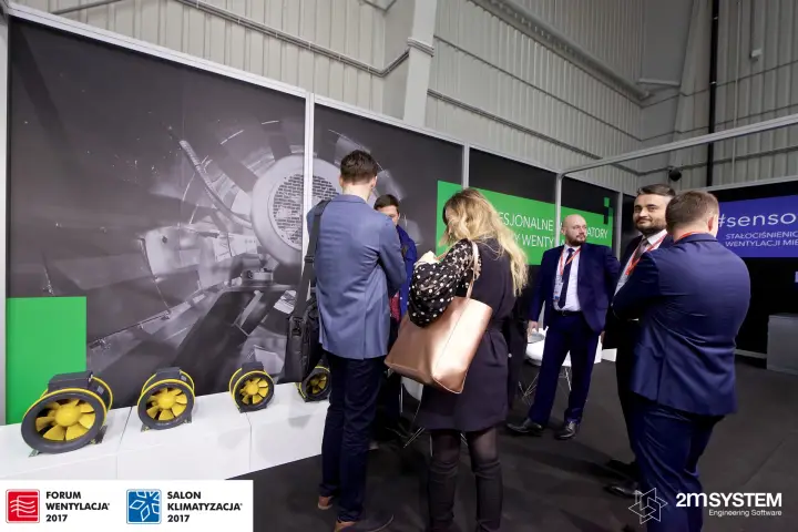 Harmann staff with visitors at the inline duct fan display at Forum Wentylacja 2017