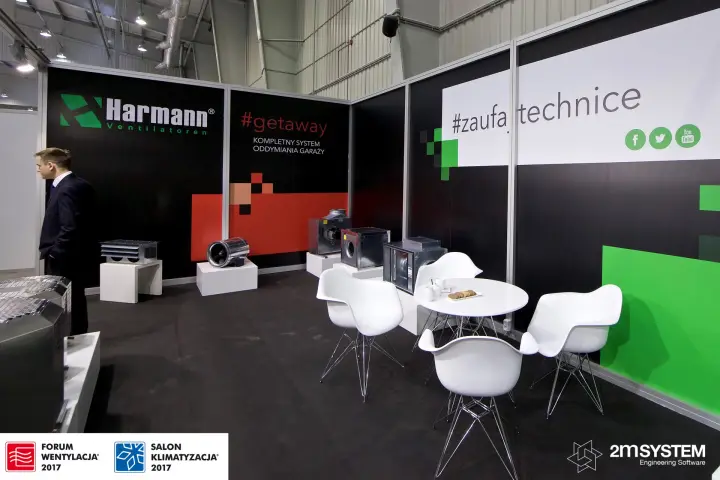 Harmann stand corner with #getaway wall and white meeting chairs at Forum Wentylacja 2017
