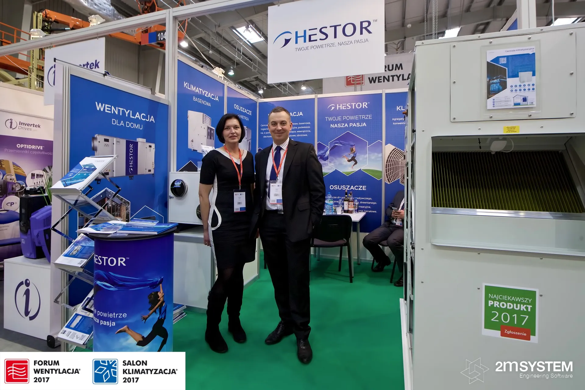 Hestor team on their blue stand beside an opened air handling unit at Forum Wentylacja 2017