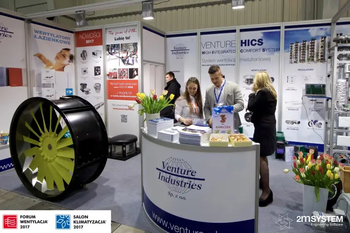 Large axial fan with yellow blades beside the Venture Industries counter