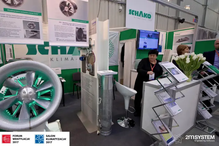 Lit Novenco axial fan in front of Schako fan banners at Forum Wentylacja 2017